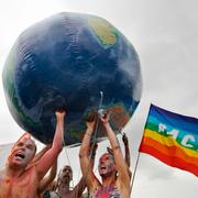 Activists of the anti-globalisation organisation Attac hold an inflatable globe during the symbolical release of the globe in the Baltic Sea off Rostock, Germany, Monday, June 4, 2007.