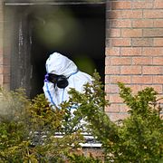 April 2025: Polisens tekniker på plats morgonen efter att en mamma och barn blivit svårt skadade vid en explosion i ett radhuhs i Tumba.