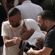 Människor i Tell sörjer efter att fem personer dödats i en konfrontation mellan israeliska bosättare och palestinska bybor på fredagen.
