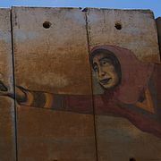 En väggmålning på gränsmuren mellan Libanon och Israel.