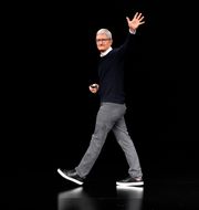 Apple CEO Tim Cook waves while walking off stage at the Steve Jobs Theater after an event to announce new products Monday, March 25, 2019, in Cupertino, Calif.  Tony Avelar / AP