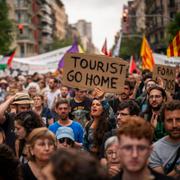 Demonstrators march shouting slogans against the Formula 1 Barcelona Fan Festival, June 19, 2024.