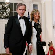 Bernard Arnault, Chairman and CEO of LVMH Moët Hennessy, and his wife Helene Mercier-Arnault arrive for the State Dinner with President Joe Biden and French President Emmanuel Macron at the White House in Washington, Thursday, Dec. 1, 2022. (AP Photo/Susan Walsh)  DCSW475