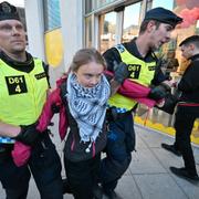 Klimataktivisten Greta Thunberg tas omhand av polis utanför Malmö Arena  i Malmö, Sverige, lördag 11 maj, 2024. 