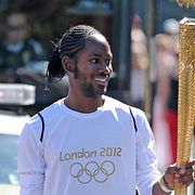 Jason Arday fick äran att springa en sträcka med den olympiska elden inför OS i London 2012.