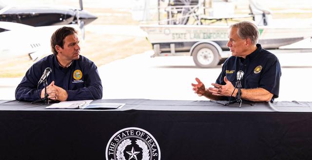 In a photo provided by Office of the Texas Governor shows, Gov. DeSantis of Florida, left, and Gov. Greg Abbott of Texas in 2021 in Del Rio, Texas. Publicly, Gov. Abbott has not criticized the migrant flights from his state by Gov. DeSantis. Privately, the Florida governor’s stunt stung the Texas governor’s team. OFFICE OF THE TEXAS GOVERNOR / NYT