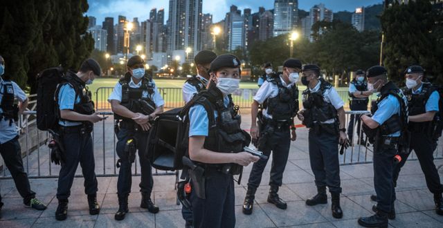 Police officers in front of Victoria Park on the anniversary of the Tiananmen Square massacre in Hong Kong, June 4, 2022. In past years, huge crowds had gathered in the park to commemorate the day. SERGEY PONOMAREV / NYT