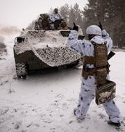 Ukrainska soldater, arkivbild från 18 februari.  Vadim Ghirda / AP
