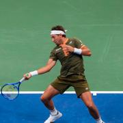 Casper Ruud och Iga Swiatek under mixed dubbel i US Open.