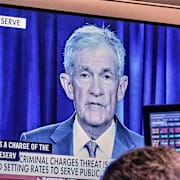 Powell på tv-skärm hos investerare.