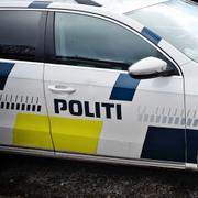 En dansk polisbil och karta som visar Själlandsbron, där skotten avlossades.