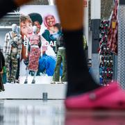 Customer walks by No Boundaries merchandise at a Walmart Superstore in Secaucus.