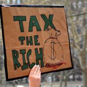 Protestors call to tax the rich and impeach Governor Andrew Cuomo following allegations of sexual misconduct and a covering-up COVID-19 related nursing home deaths on March 20, 2021 in New York City.