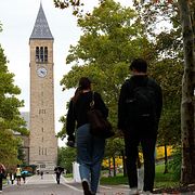 Elituniversitetet har skakats efter att en tidigare elev anklagat sju män för våldtäkt.