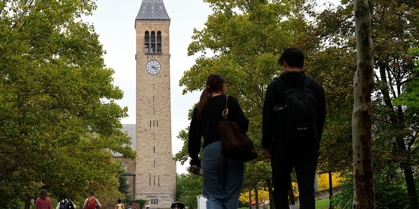 Elituniversitetet har skakats efter att en tidigare elev anklagat sju män för våldtäkt.