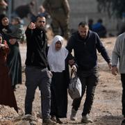 Palestinians displaced by an Israeli military operation evacuate the Jenin refugee camp in the West Bank carrying their belongings on Thursday, Jan. 23, 2025. (AP Photo/Majdi Mohammed)  JMA117