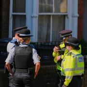 Polisen utanför ett hus i Kentish Town 13 maj. 