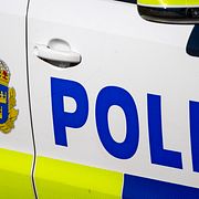 Polisbil på utryckning. 