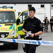 Polis på plats efter skottlossningen.