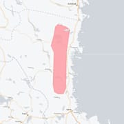 Arkivbild på snöoväder och kartan för den aktuella varningen.