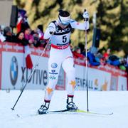 Charlotte Kalla går i mål i finalen uppför berget Alpe Cermis 2013.