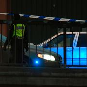 Polisens avspärrningar och tekniker på den plats nära Skärholmen centrum i Stockholm där en skottlossning ägde rum 1 februari.