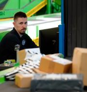 U.S. Customs and Border Protection technician Czar Zeman monitors overseas parcels as they are scanned at the agency's overseas mail inspection facility at Chicago's O'Hare International Airport Feb. 23, 2024, in Chicago. 