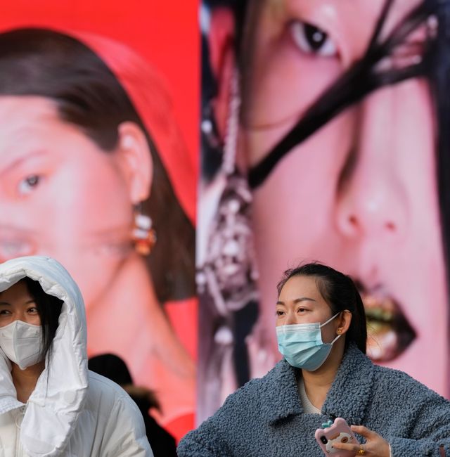 Advertisements featuring Chinese models with so-called "slanted eyes" have sparked feuding in China over whether such images perpetuate harmful stereotypes. Ng Han Guan / AP