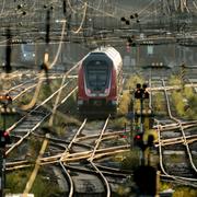 A train stands in front of the main train station in Frankfurt, Germany, Thursday, July 31, 2025. (AP Photo/Michael Probst)  PRO110