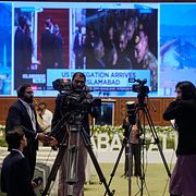 Journalister i mediecentret som byggts upp inför samtalen