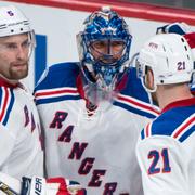 Henrik Lundqvist tillsammans med lagkamraterna Dan Girardi och Derek Stepan. 