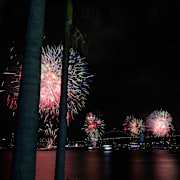 Fireworks burst over the Sydney Harbour Bridge as New Year's celebrations begin in Sydney, Wednesday, Dec. 31, 2025. (AP Photo/Rick Rycroft)  XRR103