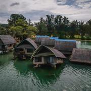 Sjunkande bostäder i Port Vila i Vanuatu den 19 juli. Önationen har varit en av de starkaste förespråkarna för att rika länder ska kunna krävas på mer i arbetet mot klimatförändringar. 