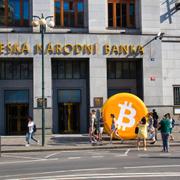 Bitcoin symbol close to main entrance at "ČNB or CNB" Czech national bank building