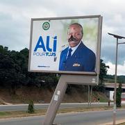 En förstörd affisch på president Ali Bongo i Gabon.