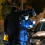 Polisen på brottsplatsen i Oxie kort efter skjutningen i december. 