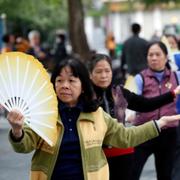 Tai chi session along the banks of Hoan Kiem lake, Hanoi, Vietnam.