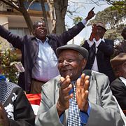 Kenyans celebrate the announcement of a legal decision in their case at Britain's High Court concerning Mau Mau veterans.