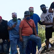 Boende vid rasmassor i Catia La Mar i Venezuela.
