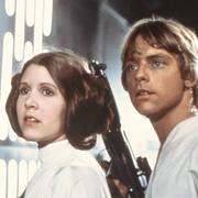 Harrison Ford, Carrie Fisher, and Mark Hamill i en scen från Star Wars.