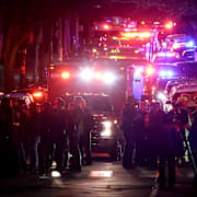 Emergency personnel gather on Waterman Street at Brown University in Providence, R.I., on Saturday, Dec. 13, 2025, during the investigation of a shooting. (AP Photo/Mark Stockwell)  MAMS208