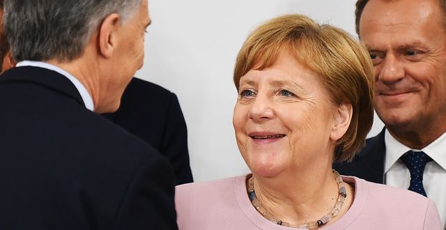 Angela Merkel och Donald Tusk. CHARLY TRIBALLEAU / AFP