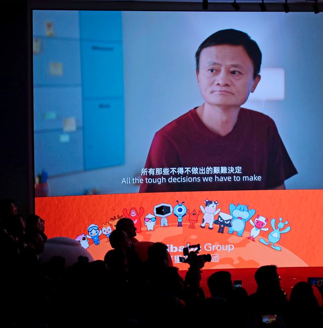A screen shows footage of Alibaba Group co-founder Jack Ma during the Alibaba Group's listing ceremony at the Hong Kong Stock Exchange (HKEX) in Hong Kong, Tuesday, Nov. 26, 2019. Kin Cheung / AP