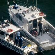 Räddnings- och sökpersonal på Hawkesbury River  efter flygolyckan som kostade Cousins liv. 