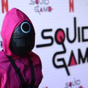 Someone dressed as a character from the show is seen at the "Squid Game" FYSEE event, Sunday, at the Netflix FYSEE at Raleigh Studios in Los Angeles.