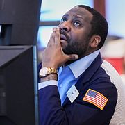 Trader Aaron Ford works on the floor of the New York Stock Exchange, Thursday, May 7, 2026. (AP Photo/Richard Drew)  NYRD413
