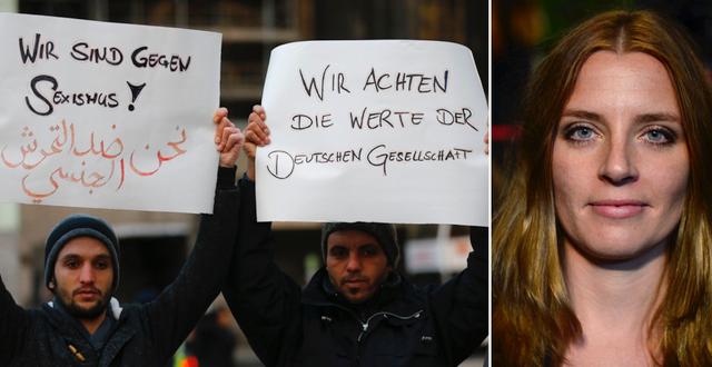 Två män från Syrien håller upp skyltar med texten ”Vi är emot sexism” och ”Vi respekterar tyska värderingar” vid en demonstration utanför centralstationen i Köln förra veckan. TT