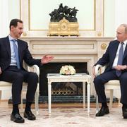 Arkivbild från juli: Assad under ett möte med Putin i Moskva.