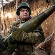 Ukrainian servicemen of 26th artillery brigade load ammunition into a self-propelled howitzer "Bohdana" before firing towards Russian positions at the frontline in Donetsk region.