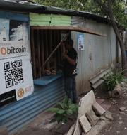 Santos Hilario Galvez, a Salvadoran who works as a builder at the Hope House, an organization that sponsors the use of cryptocurrencies in El Zonte beach, makes a purchase at a small store that accepts Bitcoin, in Tamanique, El Salvador, Wednesday, June 9, 2021. Salvador Melendez / TT NYHETSBYRÅN